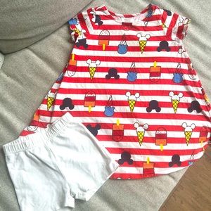 Hanna Andersson Disney Collection white HA tumble shorts.